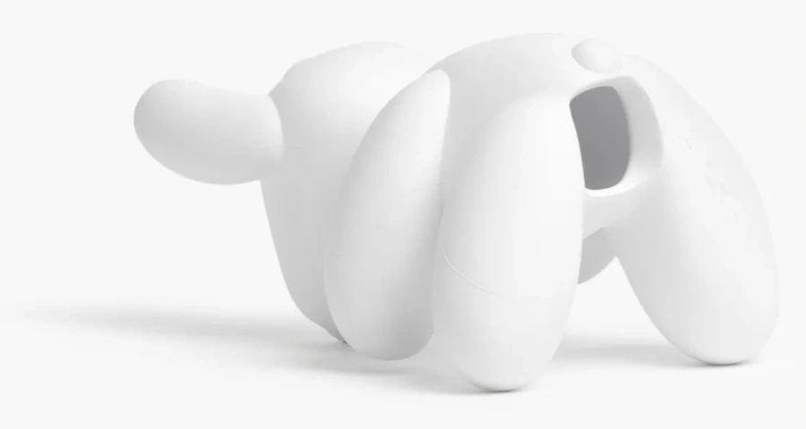 The DoggyStyle mascot: Tesla's white rubber Dog Mode Chew Toy, photographed from behind.